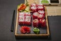 Close-up japanese sushi roll set with red flying fish caviar. Pickled ginger, spicy wasabi paste and soy sauce Royalty Free Stock Photo