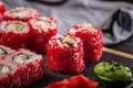 Close-up japanese sushi roll set with red flying fish caviar. Pickled ginger, spicy wasabi paste and soy sauce Royalty Free Stock Photo