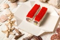 Close up of Japanese Sushi Roll with tuna, avocado wrapped in nori seaweed and rice served with red flying fish roe Tobiko caviar Royalty Free Stock Photo