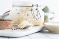 Close up of a jar of fresh sauerkraut with a fork heaping full in front. Royalty Free Stock Photo