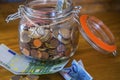 Close up of jar full of coins. Savings money for travel or dreams to realize. Euro and europe economy. Concept of making budget