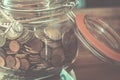 Close up of jar full of coins. Savings money for travel or dreams to realize. Euro and europe economy. Concept of making budget Royalty Free Stock Photo