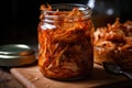 close-up of jar of kimchi, with its spicy flavor and crunchy texture visible