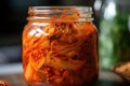 close-up of jar of kimchi, with its spicy flavor and crunchy texture visible