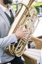 Close-up of a jazz musician's hands playing a golden tuba Royalty Free Stock Photo