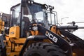 Close up of JCB digger showing bodywork, company logo branding and cab Royalty Free Stock Photo