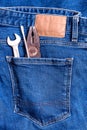 Close up of Jeans back pocket with workman tool