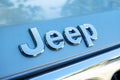 Close up of Jeep logo on the SUV auto. Jeep is a brand of American automobiles, FCA US LLC