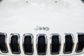 Close up of Jeep logo on white Cherokee SUV