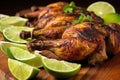 close up of jerk chicken drumsticks garnished with lime slices