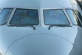 Close up of a jet airplane cockpit Front view of the airplane window with windshield wipers. Royalty Free Stock Photo