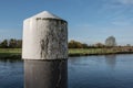 Close-up of a jetty float and water level structure seen in a river, which is part of a lock system.