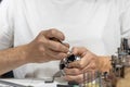 A jeweler in a workshop is working on a ring. Ring in the hands of a jeweler close-up Royalty Free Stock Photo