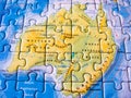 Close up of a jigsaw puzzle map depicting Australia Royalty Free Stock Photo