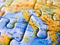 Close up of a jigsaw puzzle map depicting Rome and Italy