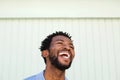 Close up joyful african american man laughing