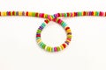 Close Up of Joyful Color of Old Jewellery Beads Handmade String White Background