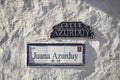 Close up of Juana Azurduy street sign on a white wall in Sucre, Bolivia Royalty Free Stock Photo