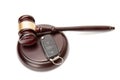 Close up of judge gavel and car keys over soundboard