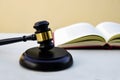 Close up of judge gavel, lawyer with law book in background. Concept of law. Royalty Free Stock Photo