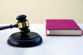 Close up of judge gavel, law, justice with a book in background. Royalty Free Stock Photo