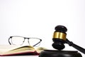 Close up of judge gavel, lawyer, law, justice is near the law book and glasses on the book with white background. Law and Royalty Free Stock Photo