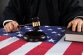 Judge Hands With Gavel And American Flag Royalty Free Stock Photo