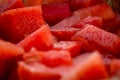 Close up of juicy red watermelon fruit that has been cut into cubes chunks