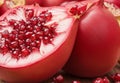 A close-up of a juicy, ripe pomegranate, its ruby-red seeds bursting with flavor.