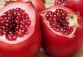 A close-up of a juicy, ripe pomegranate, its ruby-red seeds bursting with flavor.