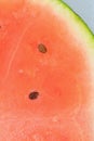 Close-up of juicy watermelon slice. Slice of ripe melon in sparkling water, close-up. Vertical macro image. Royalty Free Stock Photo