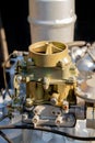 Close-up of a K126I carburetor, a complex mechanical component of an engine, featuring various levers, screws, and linkages Royalty Free Stock Photo