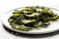 close up of kale chips with parmesan on a white plate