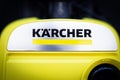 Close-up on Karcher logo on a yellow vacuum cleaner