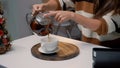 Close up of kettle and cup of tea on kitchen counter Royalty Free Stock Photo