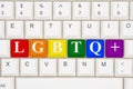 A close-up of a keyboard with highlighted text LGBTQ+