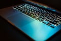 Close up of keyboard of a modern laptop. laptop backlit keyboard. Selective focus. Isolated on black