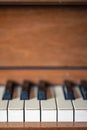 Close-up, keys of an antique wooden piano.