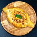 Close up of Khachapuri boat cheese on the plate