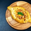Close up of Khachapuri boat cheese on the plate