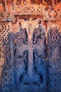 Close up of khachkar, covered with lichen, located on the bank of Sevan Lake, on cemetery of Hayravank Monastery, Armenia.