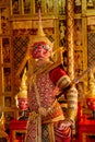 Close up Khon or traditional Thai classic masked from the Ramakien with Red giant character stand with spear and look forward with