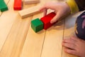 Close up of a Kid hand Playing with Colourful Blocks