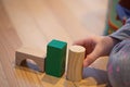 Close up of a Kid hand Playing with Colourful Blocks