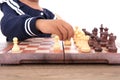 Close-up of kid playing chess on chessboard Royalty Free Stock Photo