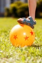 Close up of kid putting on ball foot Royalty Free Stock Photo