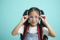 Close-up kid schoolgirl wearing glasses, she nice cute attractive cheerful amazed. Royalty Free Stock Photo