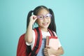 Close-up kid schoolgirl wearing glasses, she nice cute attractive cheerful amazed. Royalty Free Stock Photo