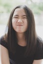 Close up kidding face of cheerful asian teenager with long brown hair Royalty Free Stock Photo