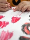 Kids coloring in paper